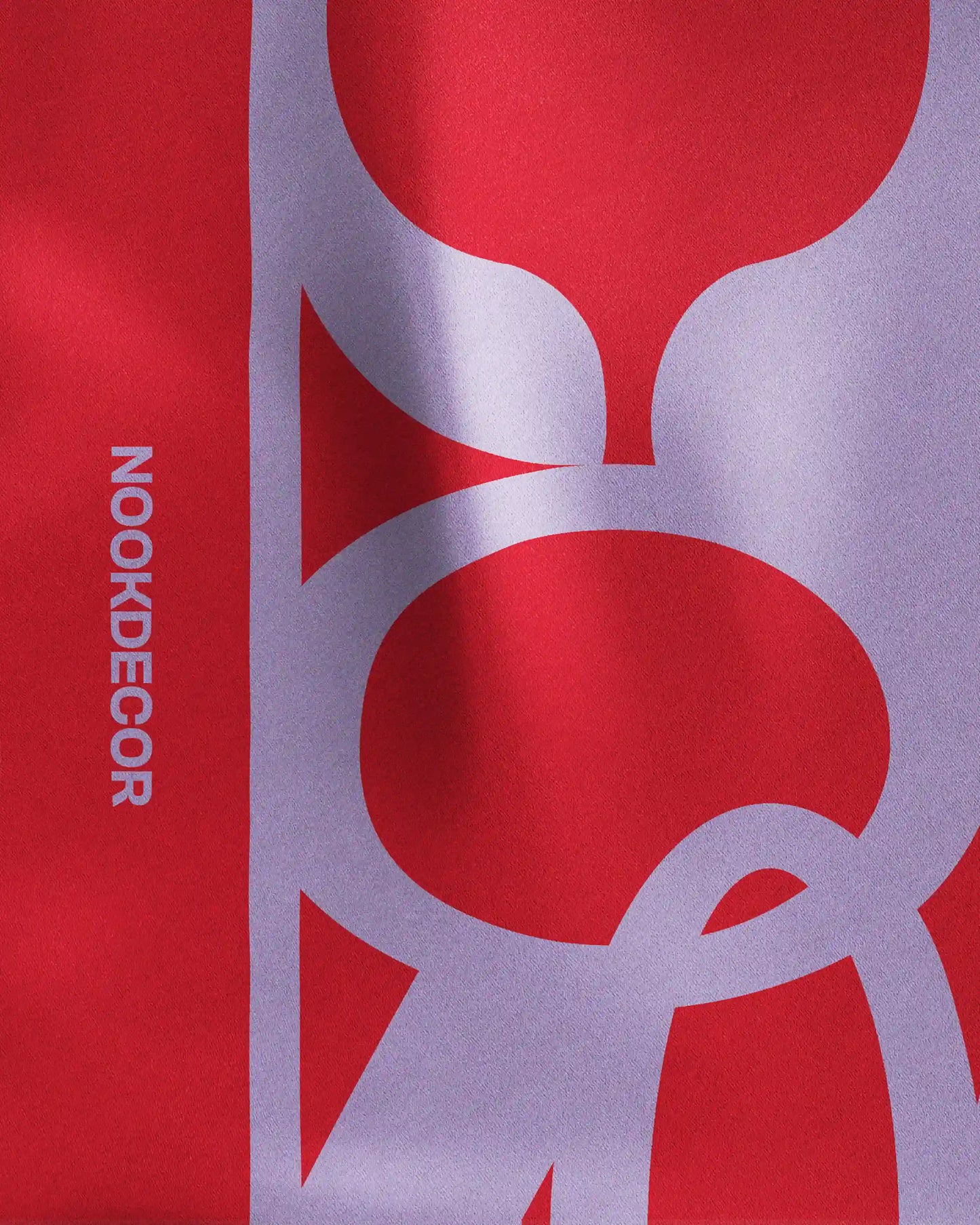 Close-up detail of the intricate NOOKDECOR’s logo design on this 100% mulberry silk bandana, highlighting its quality as a luxury and chic twilly scarf and statement colorful eye candy accessories