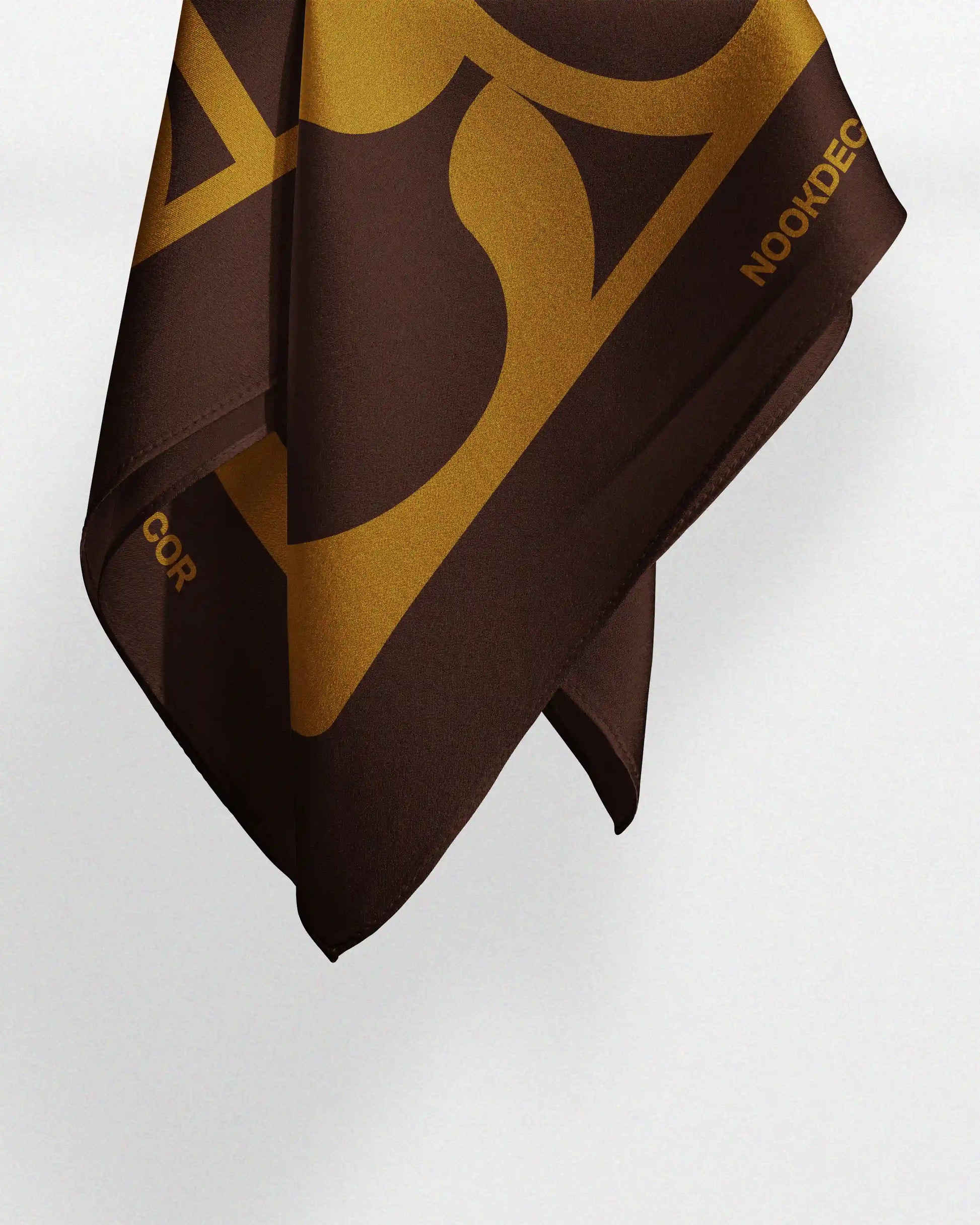 Retro silk bandana hanging naturally to demonstrate its dynamic drape and incredible softness, features a 70s golden mustard yellow and dark brown, best fit for Y2K trendy daily outfit.