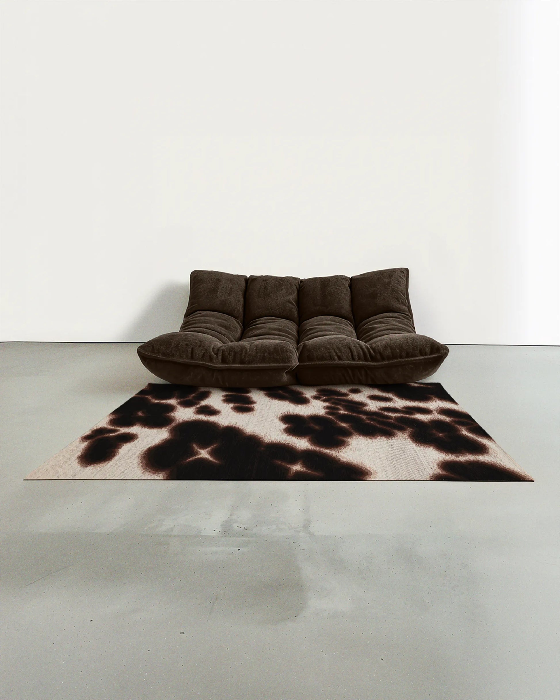 Modern dark brown togo sofa on Mid century modern style decorative abstract floral cowhide area rug, with dark brown and off white hues in a minimalist, Scandinavian living room.