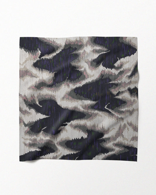 A designer bandana in an abstract fish and floral mix, showcasing its potential as a dopamine waist scarf, neckerchief or handkerchief.