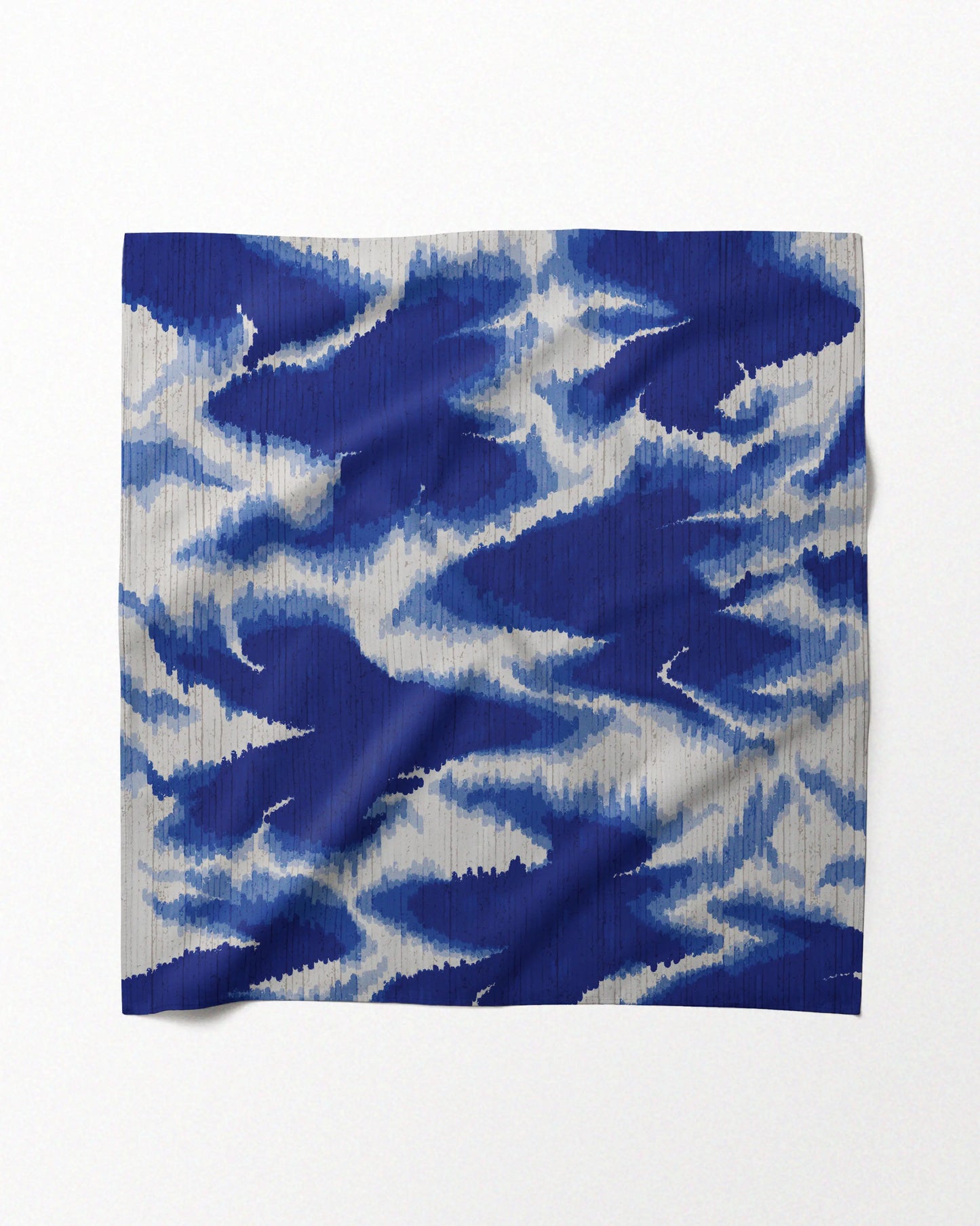 Flat lay of a vibrant dopamine dressing 100% mulberry silk scarf placed on a beige background for eclectic style dressing.