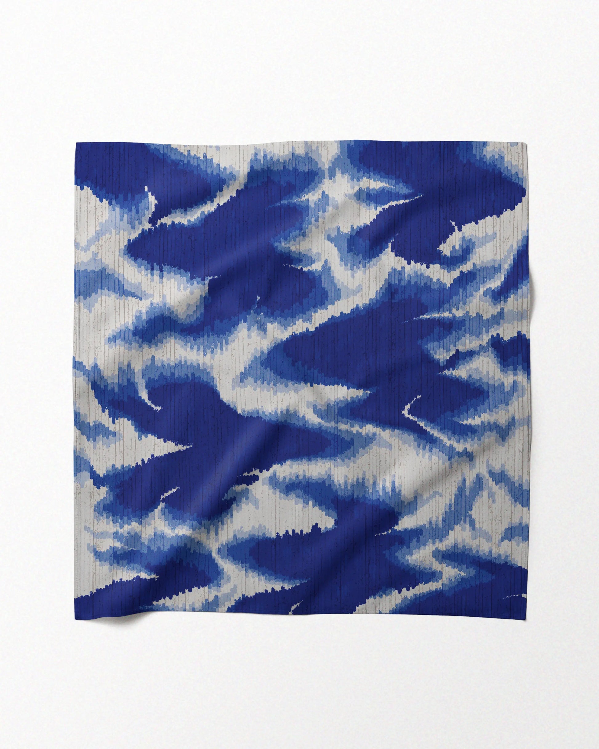 Flat lay of a vibrant dopamine dressing 100% mulberry silk scarf placed on a beige background for eclectic style dressing.