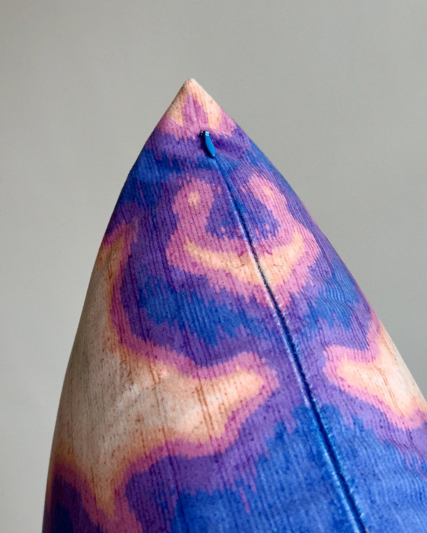 Close-up of hidden zipper closure in blue on purplish blue and light green abstract floral cowhide cushion cover, showing easy insertion and premium construction details.