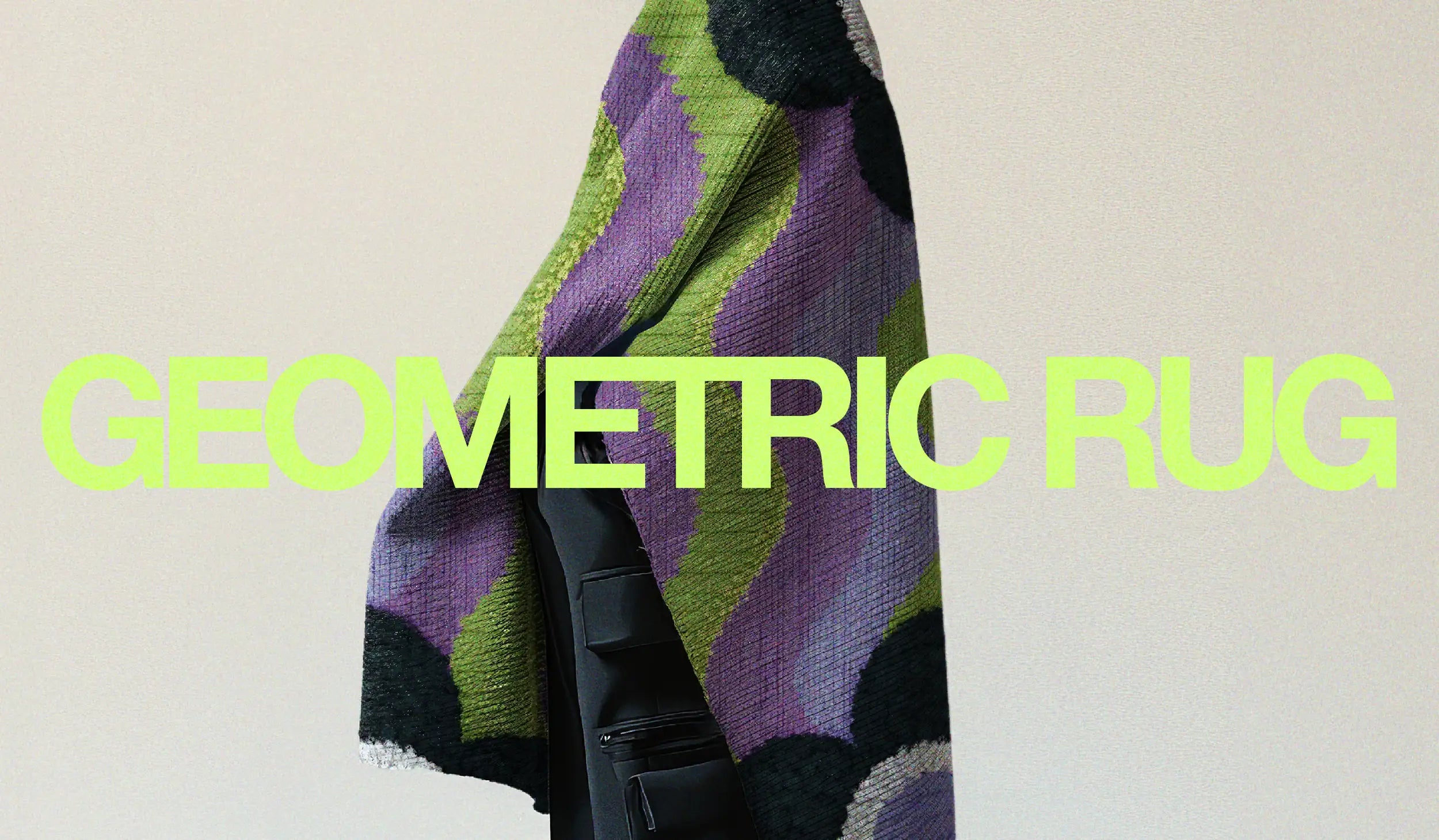 Homepage here image of a man showcases an eclectic area rug in rich lavender purple and deep navy blue, embellished with vibrant green accents and a geometric poppy floral pattern, inspiring a joyful and dopamine home space.