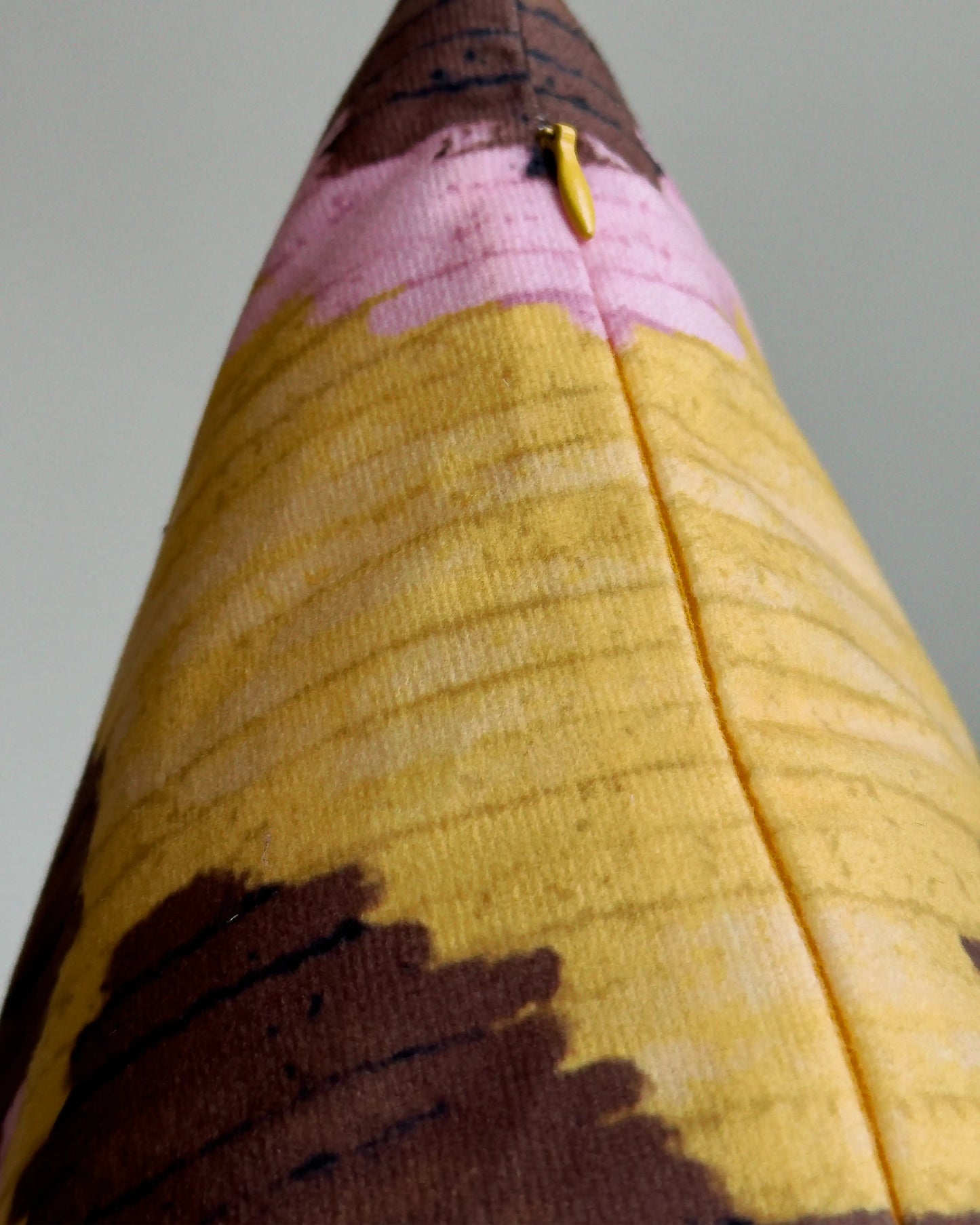 Close-up of hidden zipper closure in cream white on yellow and brown abstract floral leopard cushion cover, showing easy insertion and premium construction details.