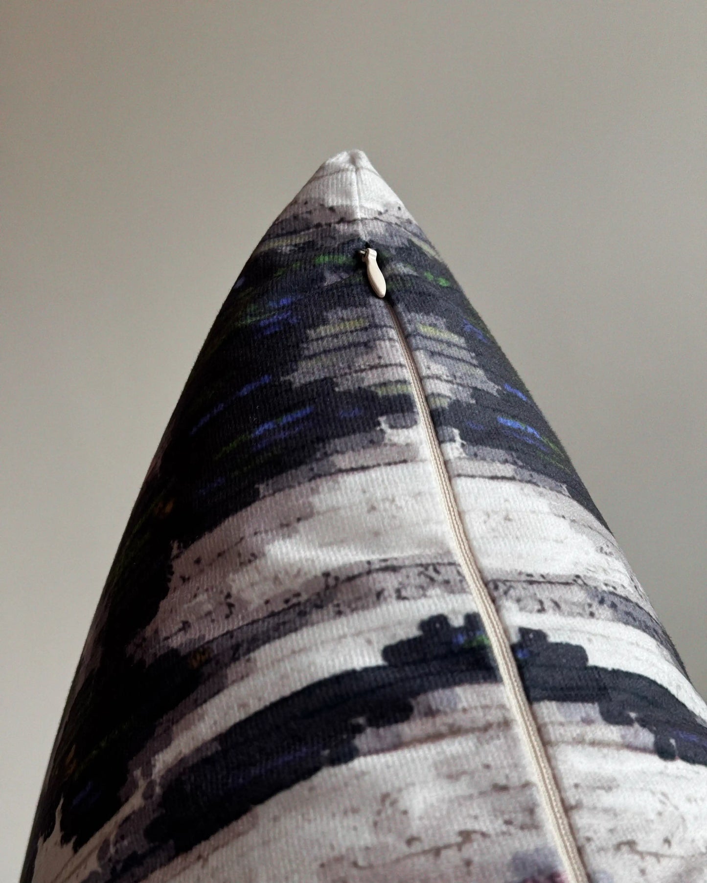 Close-up of hidden zipper closure in cream white on dark grey and beige white abstract floral leopard cushion cover, showing easy insertion and premium construction details.