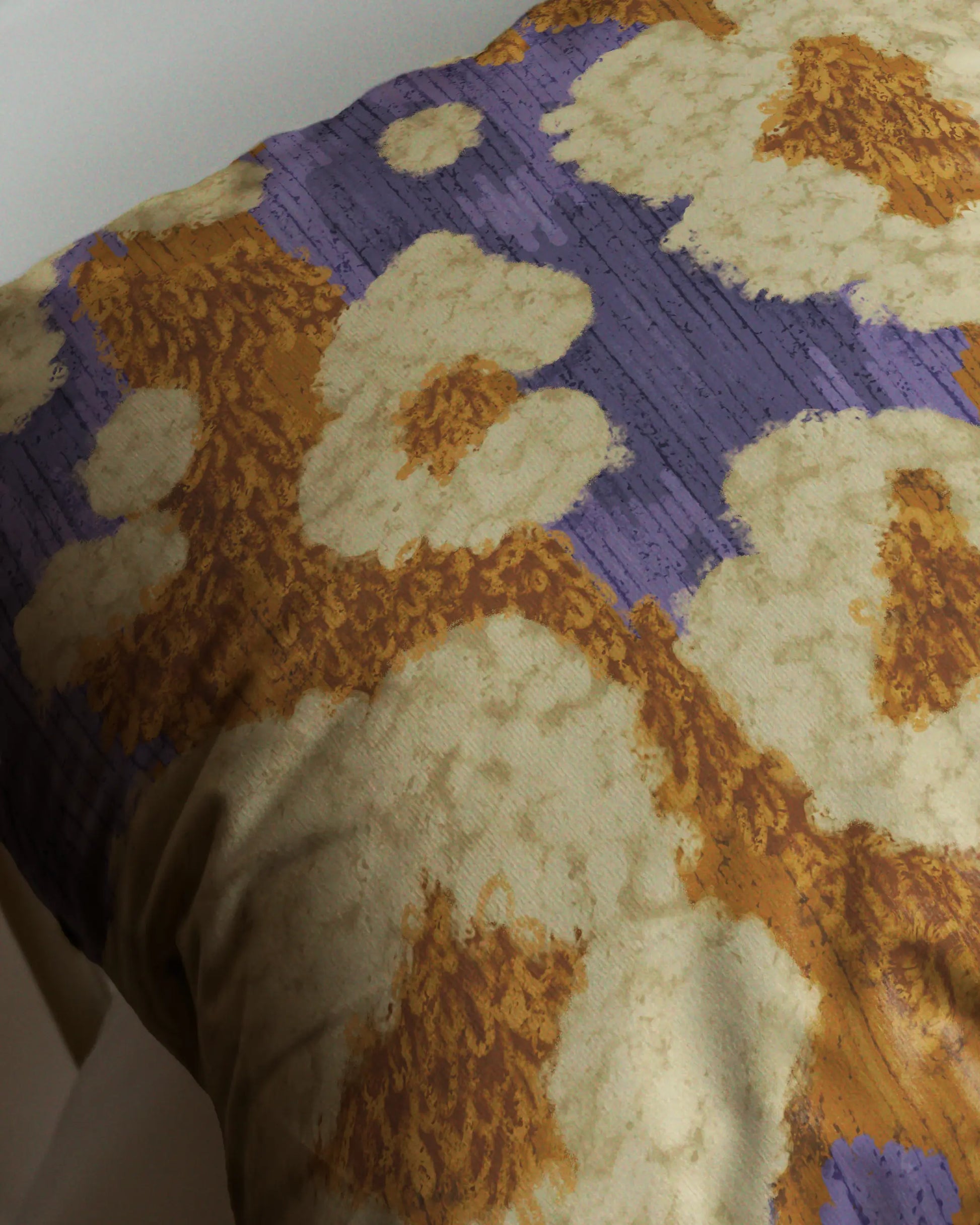 Extreme close-up of abstract leopard and floral cushion cover, showcasing pastel purple, mustard yellow, and creamy beige pop corn pattern details.