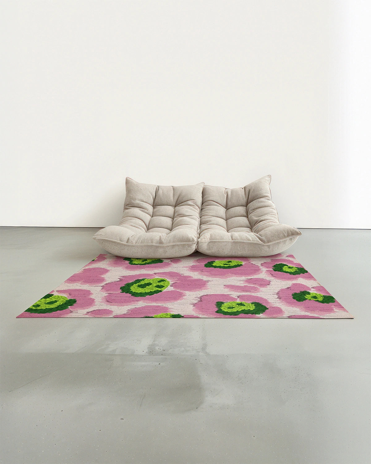An eclectic floral area rug with cute leopard patterns in pink and green hues placed in a modern studio with a white Togo sofa.
