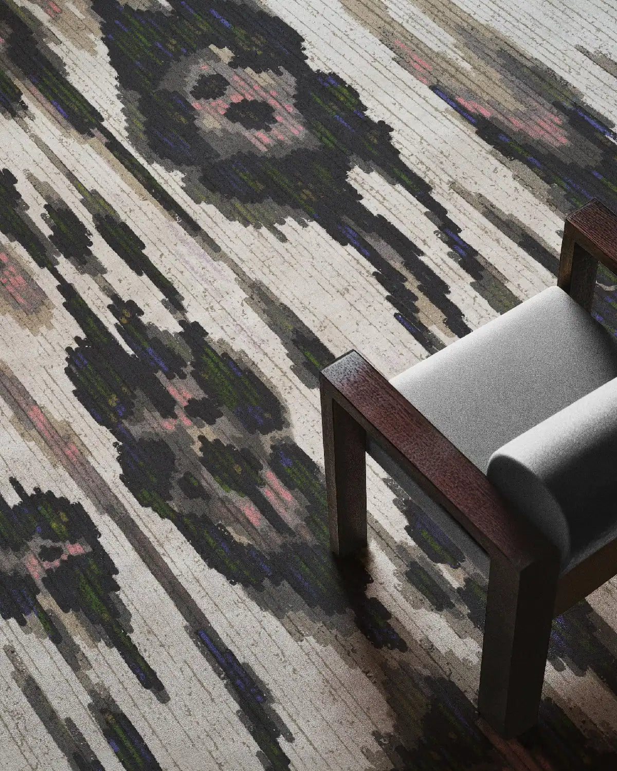 Leopard area rug with black, white, and beige hues with an off white wooden chair in a mid-century modern home.