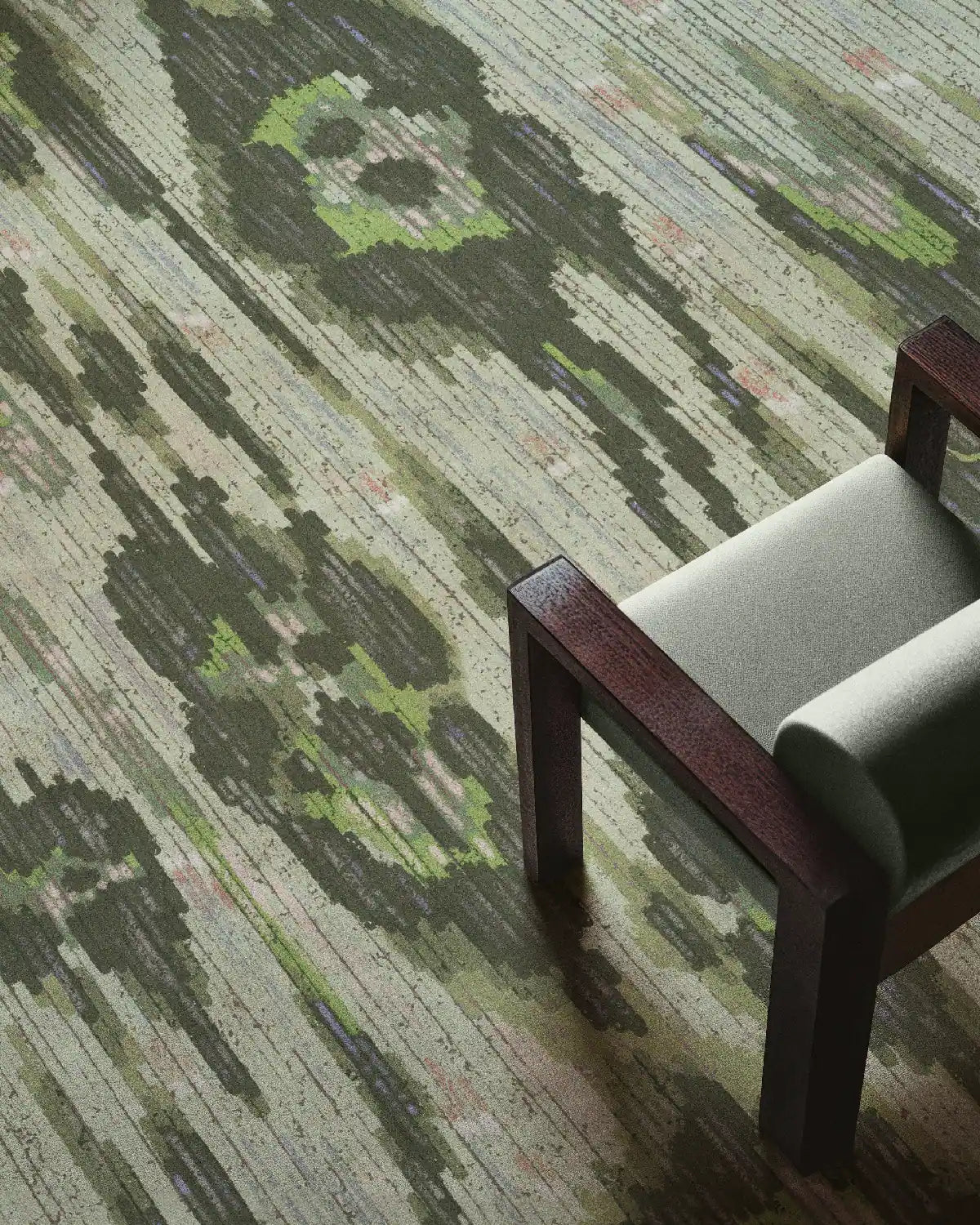 Abstract leopard floral area rug in sage green hues placed underneath a mint green chair featuring its colorful and vivid designs perfect for eclectic home decor style.