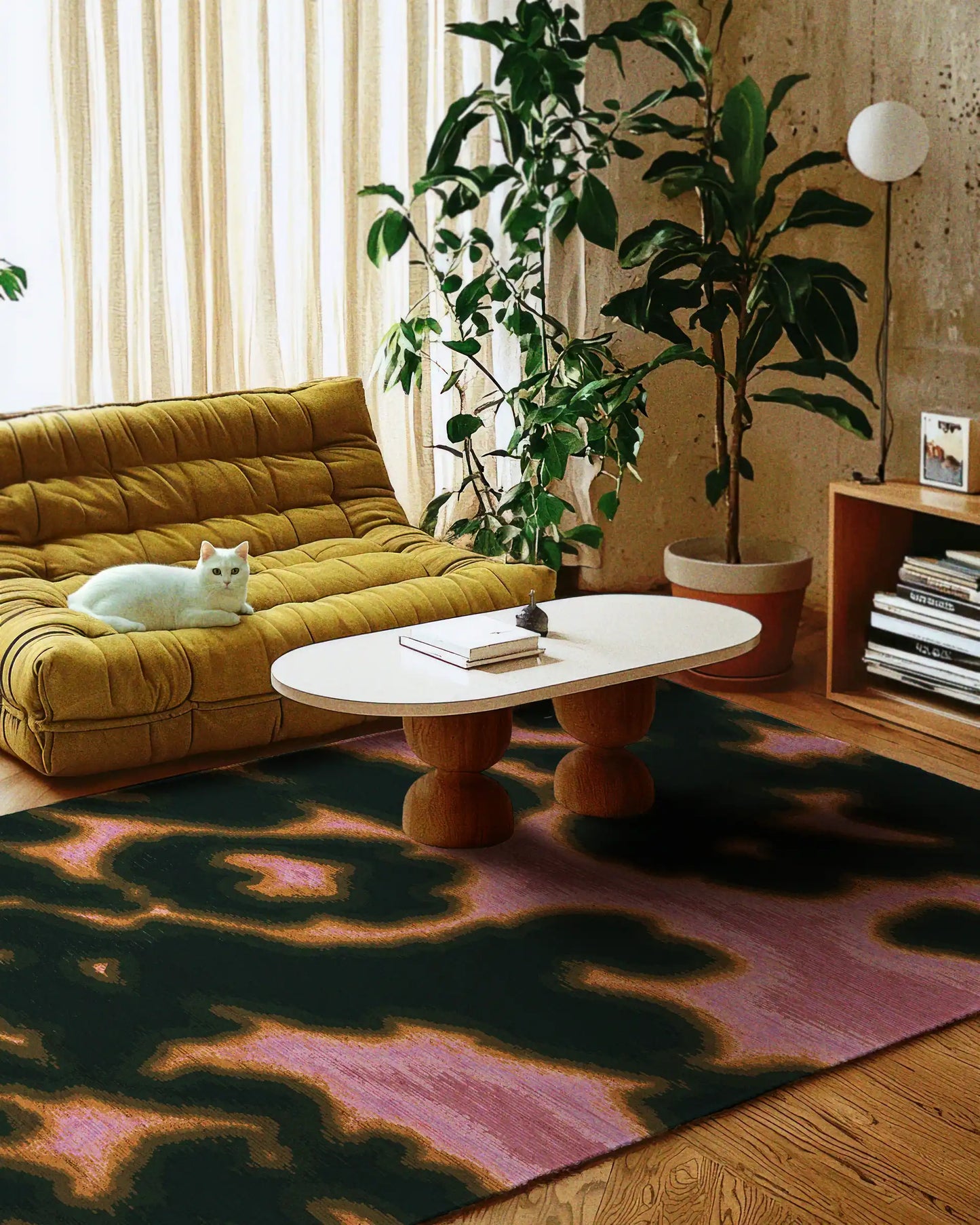 Faux cowhide rug featuring eclectic patterns, hot pink and green tones, adding style to an eclectic apartment with a maximalist feel with a house plant and cozy furniture.