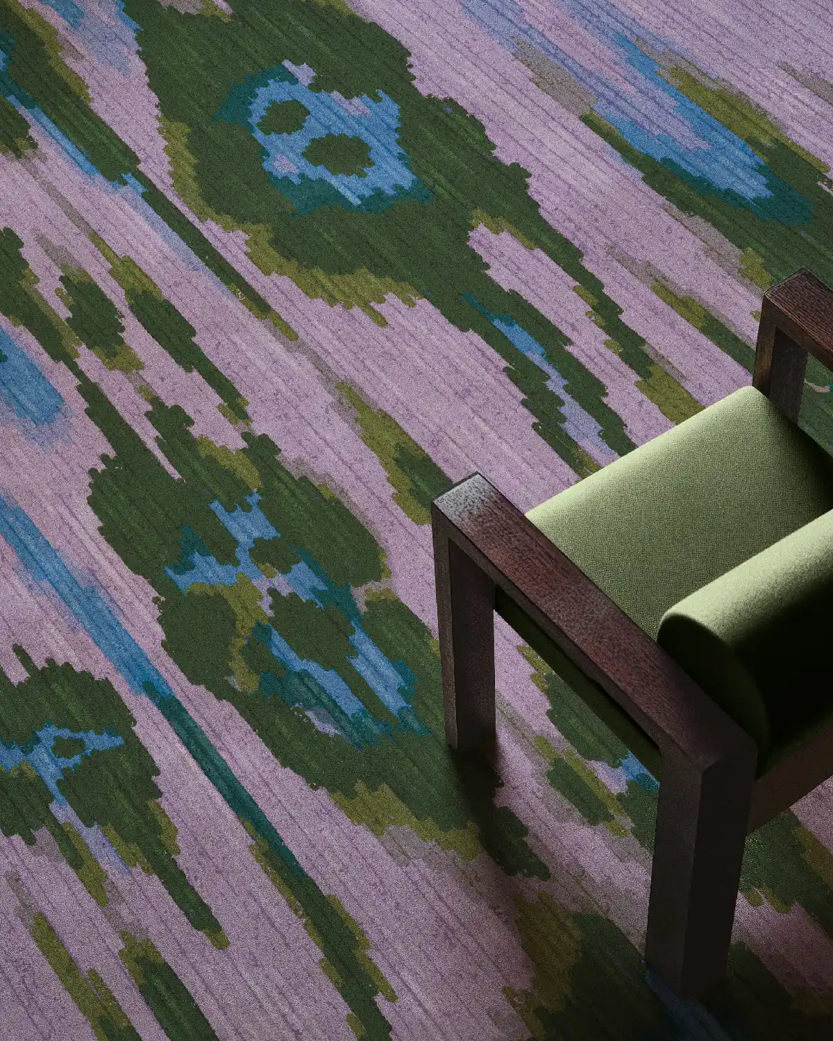 Overhead shot of a coquette eclectic home decor for maximalist space features leopard patterns in purple, blue, and green with a mint chair set on top.